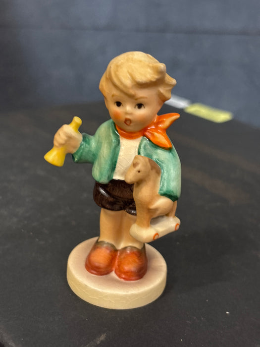SMALL BOY HUMMEL WITH HORN AND ROCKING HIRSE