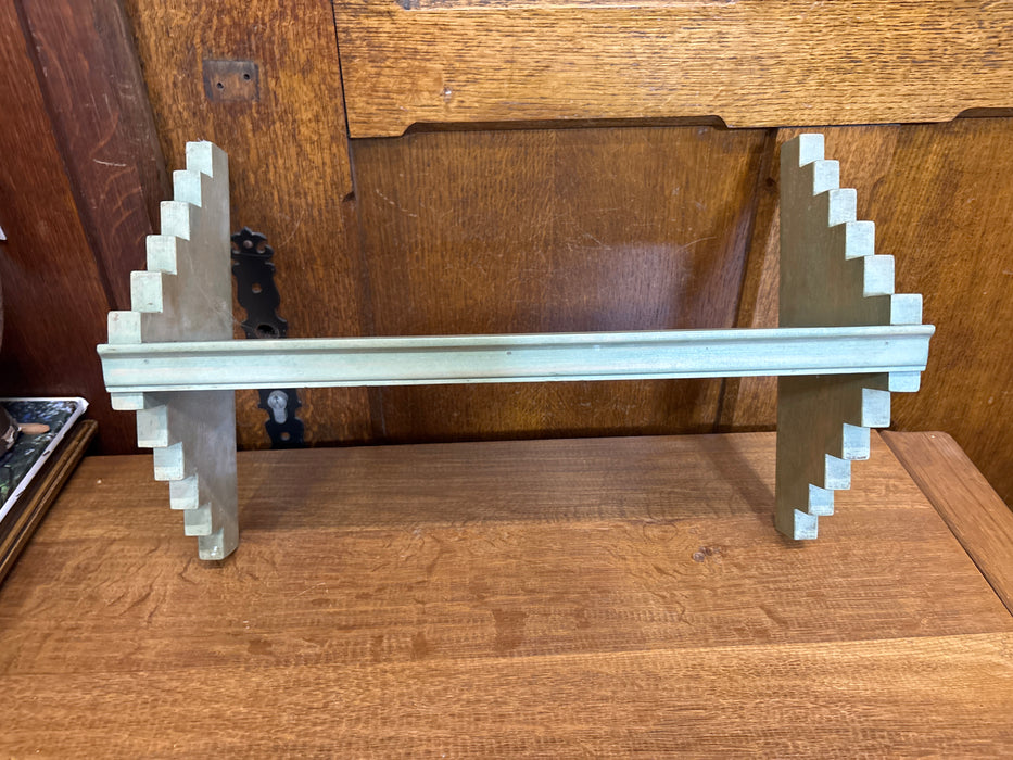 GREEN TRIANGLE SHAPED WALL SHELF