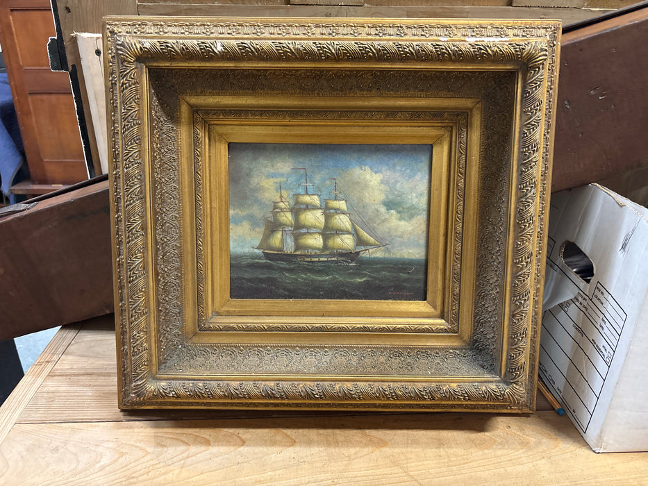 SMALL FRAMED OIL PAINTING OF A SHIP AT SEA
