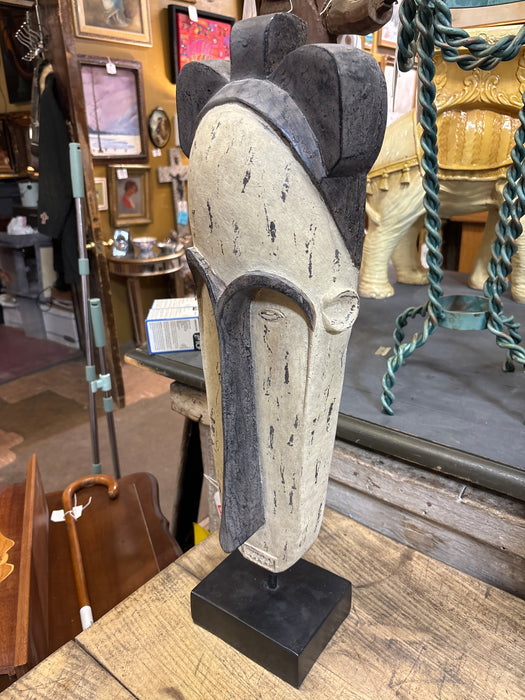 TALL BLACK AND WHITE MASK ON STAND