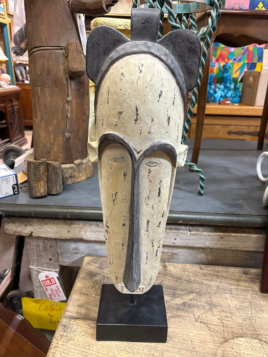 TALL BLACK AND WHITE MASK ON STAND
