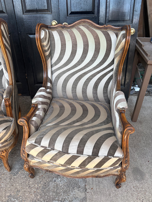 MISMATCHED PAIR OF SWIRLY ZEBRA UPHOLSTERED WING BACK CHAIRS