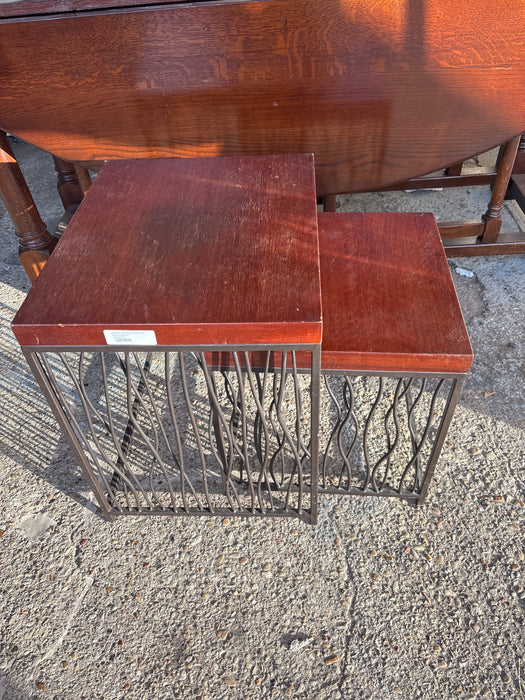 PAIR OF STACKING IRON AND WOOD NESTING TABLES