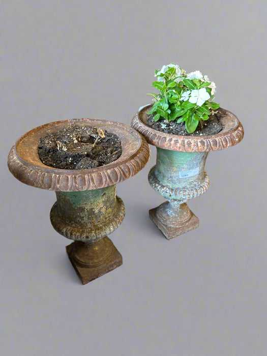 PAIR OF ANTIQUE CAST IRON FOOTED PLANTERS