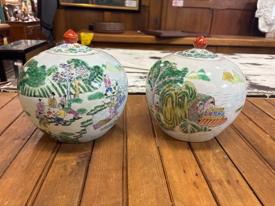PAIR OF SMALL GREEN GINGER JARS WITH ORANGE FINIAL