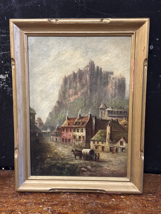 ANTIQUE GOLD FRAMED EUROPEAN VILLAGE PAINTING WITH MOUNTAIN AND WAGON