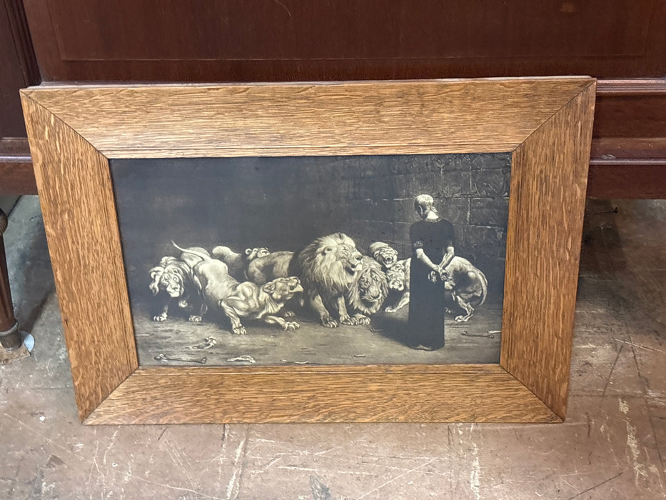 SMALL FRAMED PAINTING OF MAN FACING PRIDE OF LIONS