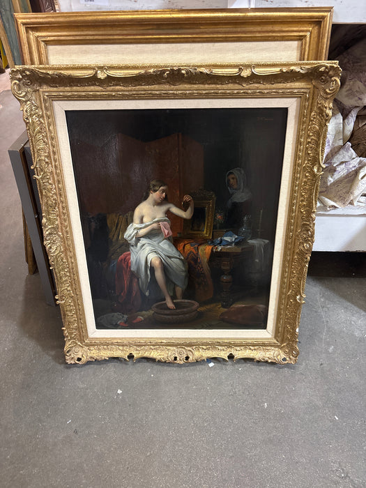 LARGE ORNATE GILT FRAMED PAINTING OF WOMAN BEING WATCHED BY SERVANT IN LINEN FILET