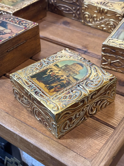 SMALL GOLD FLORENTINE BOX WITH DECOUPAGE PAINTING OF CEREMONY IN FRONT OF BUILDING