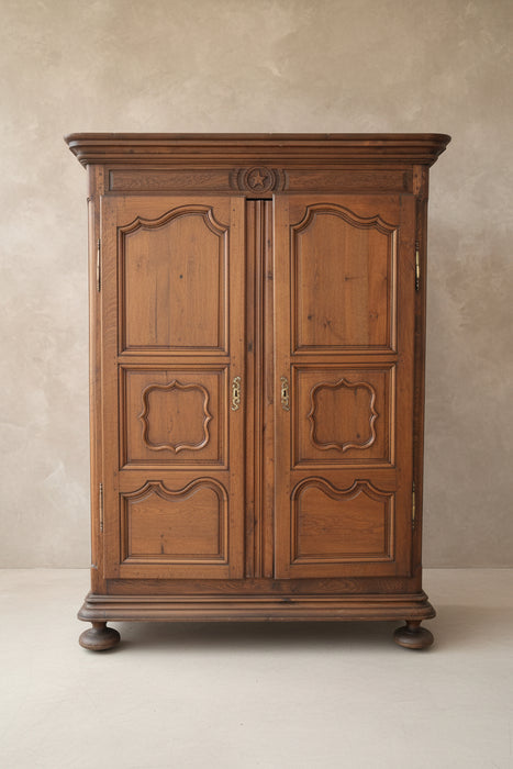 ANTIQUE LOUIS XV CARVED WALNUT ARMOIRE WITH BUN FEET
