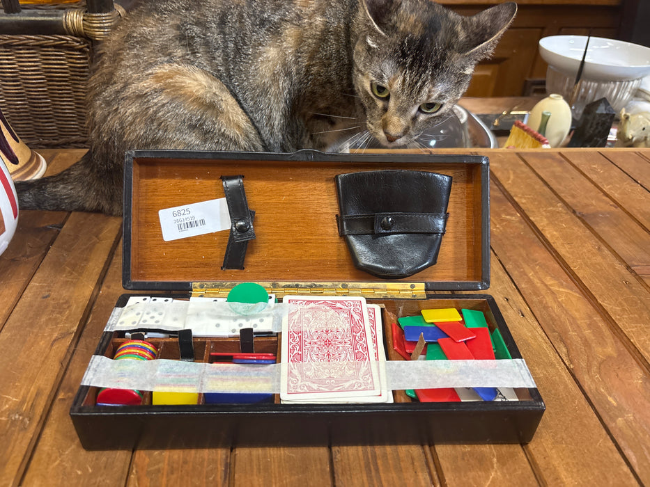 BLACK GAMING BOX WITH CARDS, DOMINOS, AND COLORED CHIPS