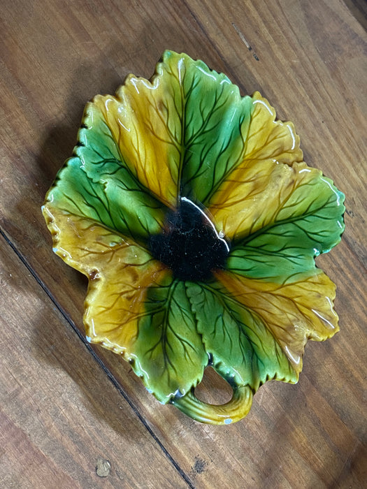 SMALL GREEN AND YELLOW MAJOLICA LEAF DISH WITH DARK CENTER AND HANDLE