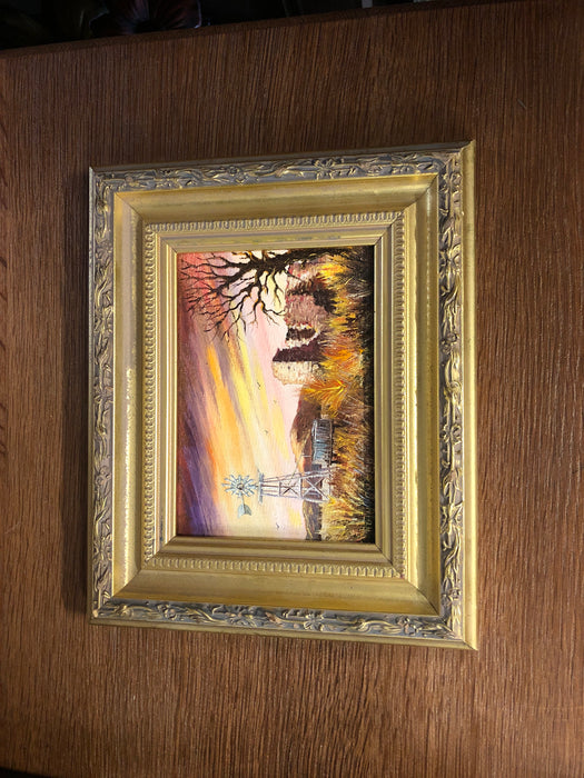 FRAMED PAINTING OF A WINDMILL WITH RUINS