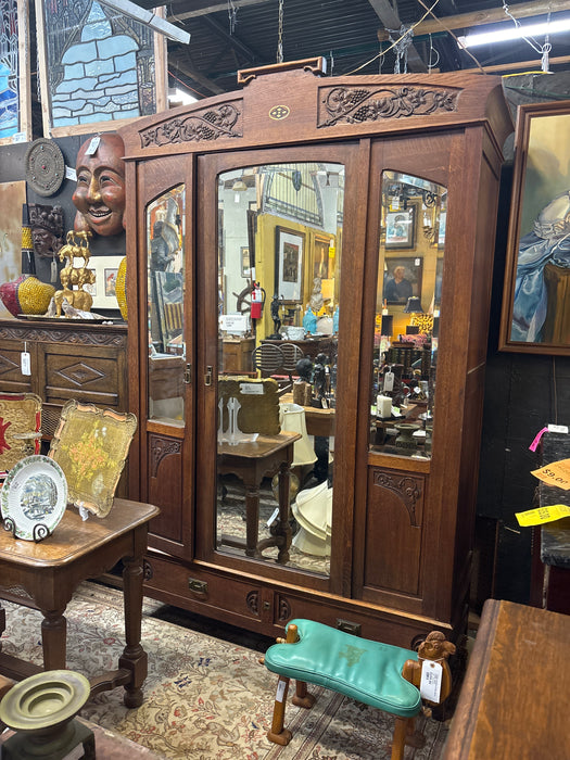 ART NOUVEAU OAK TWO DOOR ARMOIRE WITH GRAPE VINES