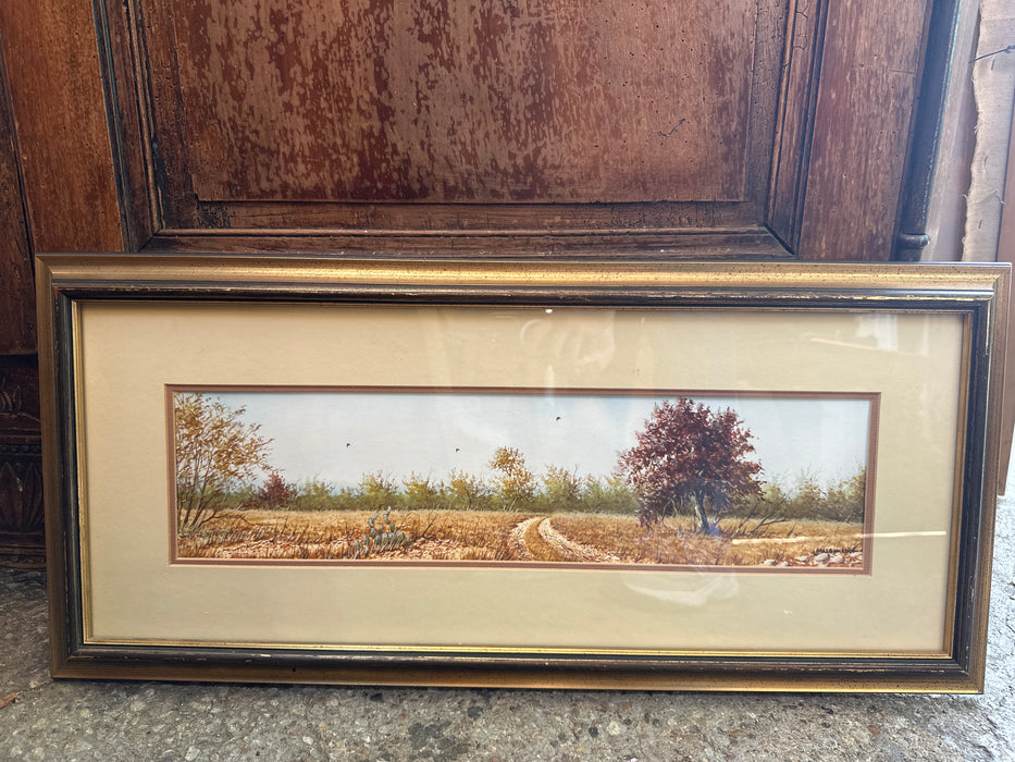 SMALL FRANED HORIZONTAL WATER COLOR OF A ROAD THROUGH BLUEBONNETS SIGNED DANIEL MALDONAD0
