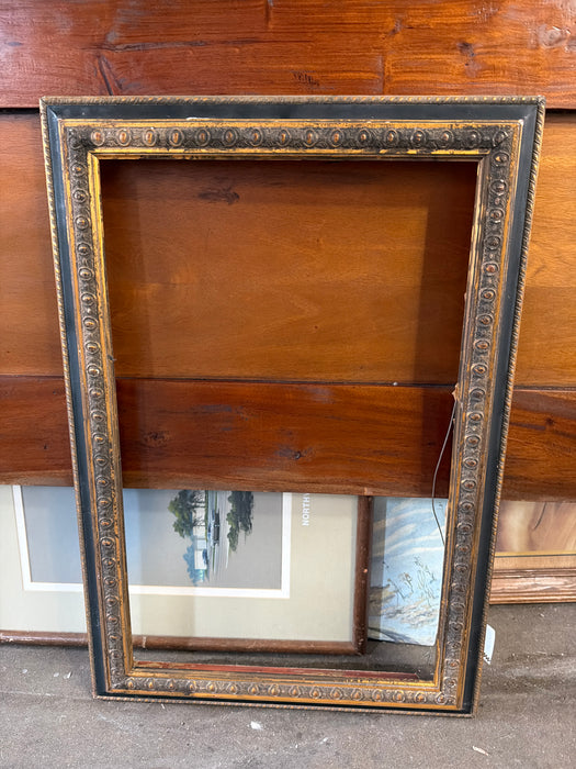 GOLD AND BLACK FRAME WITH DETAIL