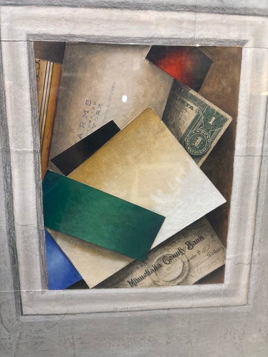 MEDIUM SILVER GILT FRAMED PRINT OF COLORFUL ASSORTMENT OF DESK PAPERS IN GRAY MATTE