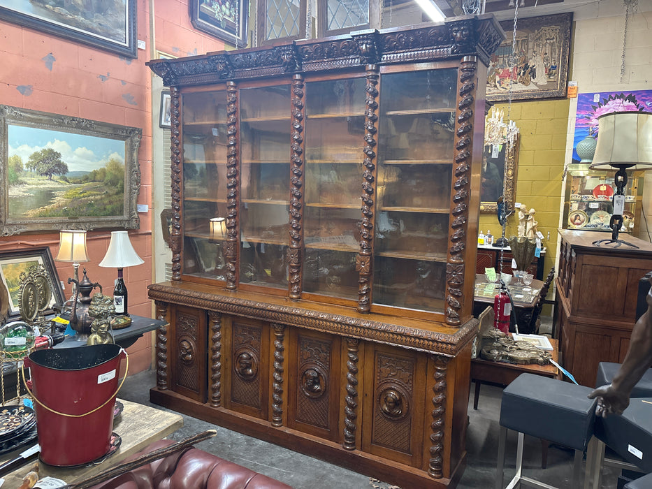 HUGE STEPBACK 4 DOOR CARVED PORTRAIT HEAD BOOKCASE WITH FOLIATE TWIST COLUMNS