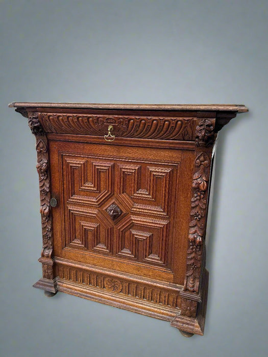 MECHILIN CARVED OAK CABINET