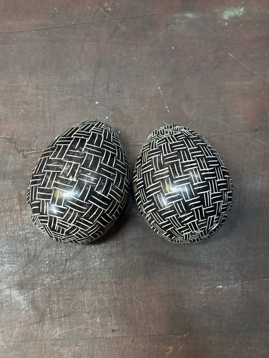 PAIR OF STONE BLACK HATCHING EGGS