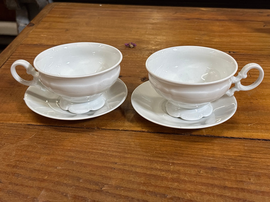 PAIR OF WHITE FRENCH PORCELAIN TEA CUPS