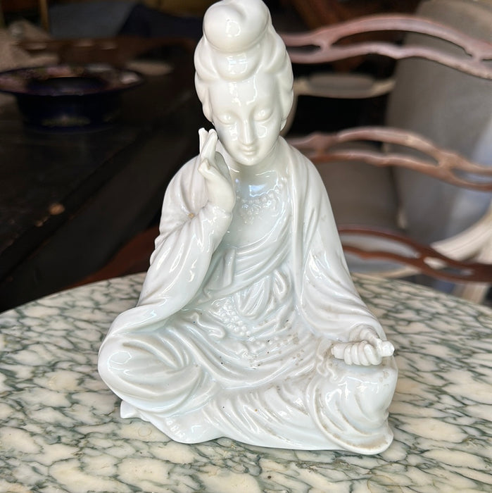 BLANC DE CHIN SITTING WOMAN