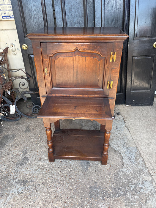 NARROW DARK OAK CABINET ON LEGS WITH PULL OUT