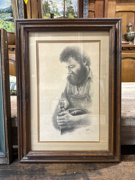 FRAMED PRINT OF A CARPENTER