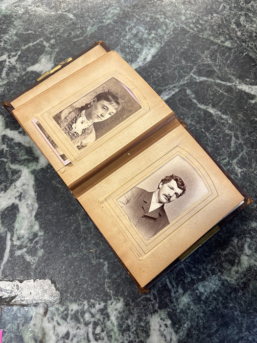 SMALL EARLY EMBOSSED PHOTO ALBUM WITH AS FOUND BINDING