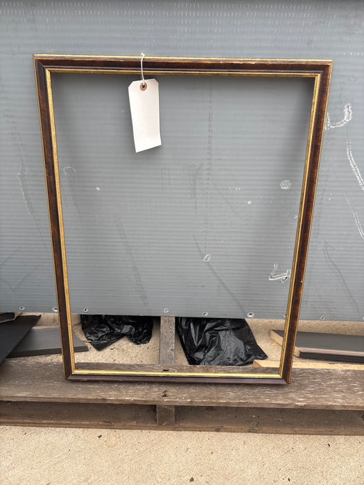 THIN BROWN WITH GILT FRAME