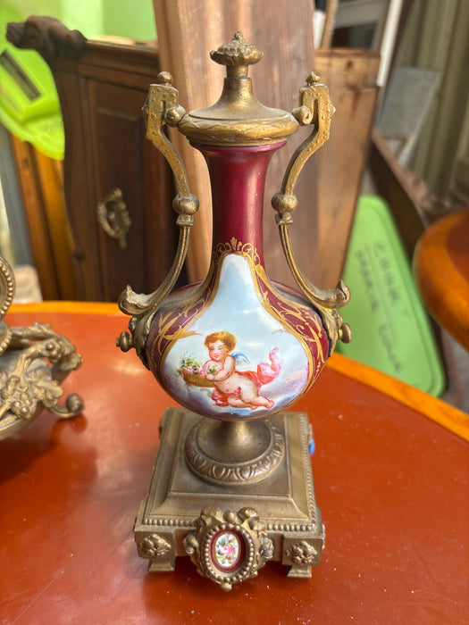 3 PIECE BRASS AND RED PORCELAIN GARNITURE CLOCK SET WITH CHERUBS