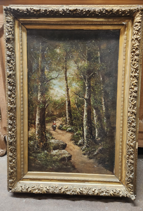 GOLD FRAMED VERTICAL OIL PAINTING OF LADY IN WOODS