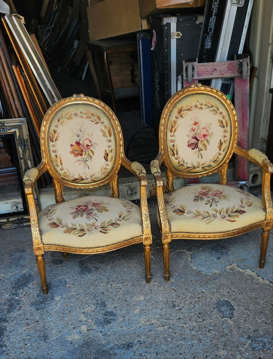 PAIR OF LOUIS XVI NEEDLEPOINT GILT FAUTEUILS (OPEN ARM CHAIRS}