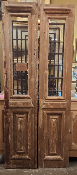 PAIR OF  PRIMITIVE EGYPTIAN DOORS WITH GEOMETRIC IRON INSETS