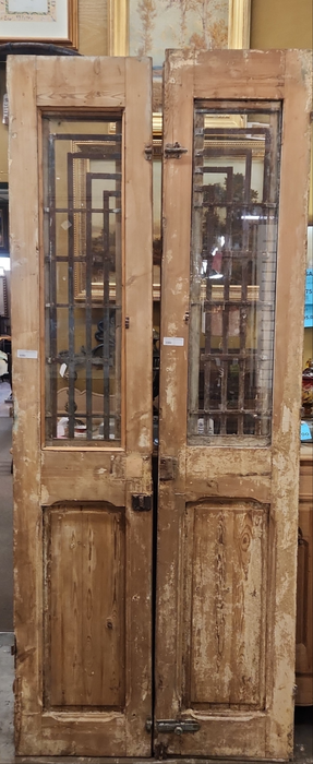 PAIR OF  PRIMITIVE EGYPTIAN DOORS WITH GEOMETRIC IRON INSETS