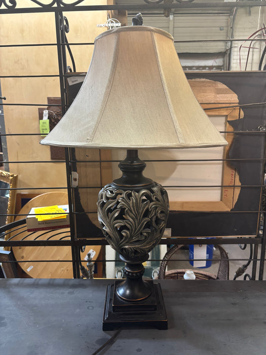 PAIR OF GOLD AND BLACK COMPOSITION FOLIATE TABLE LAMPS
