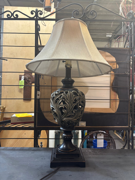 PAIR OF GOLD AND BLACK COMPOSITION FOLIATE TABLE LAMPS