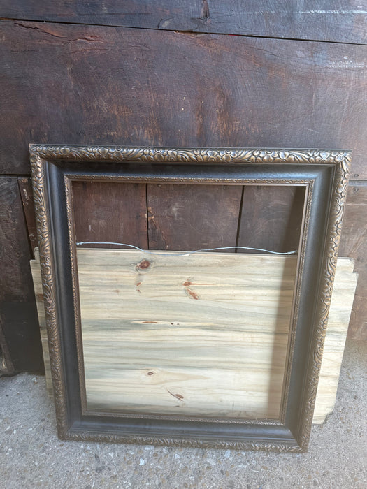 LARGE CARVED WOOD FRAME WITH BLACK