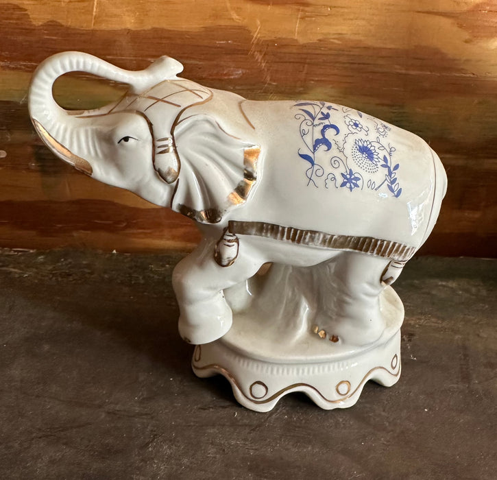 PORCELAIN ELEPHANT WITH GOLD TUSKS