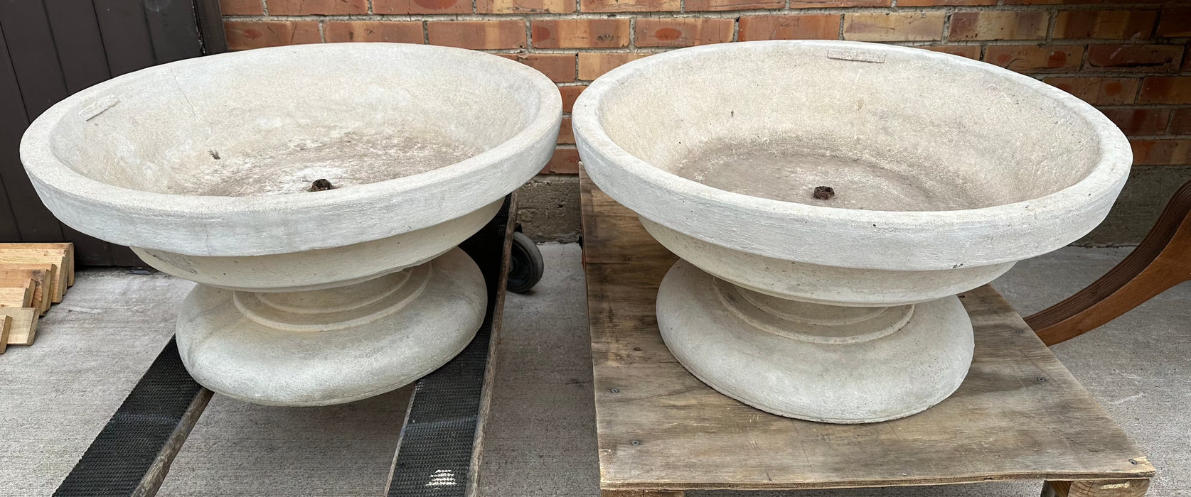 PAIR OF LARGE CONCRETE PLANTERS