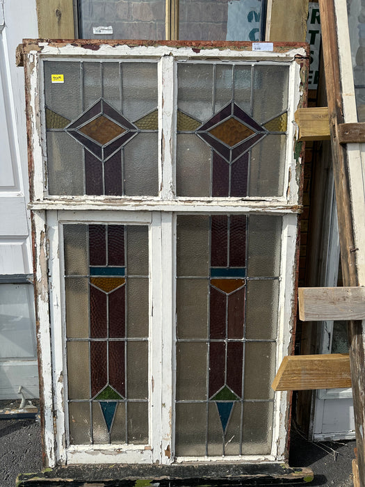 WINDOW IN VERTICAL FRAME WITH PURPLE BLUE AND YELLOW