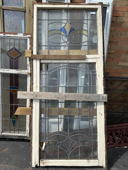 TALL STAINED GLASS WINDOW WITH YELLOW AND BLUE TOP AS FOUND