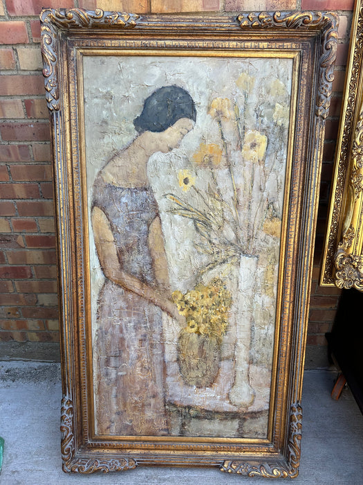 WOMAN ARRANGING YELLOW FLOWERS BY ELVA LEVY