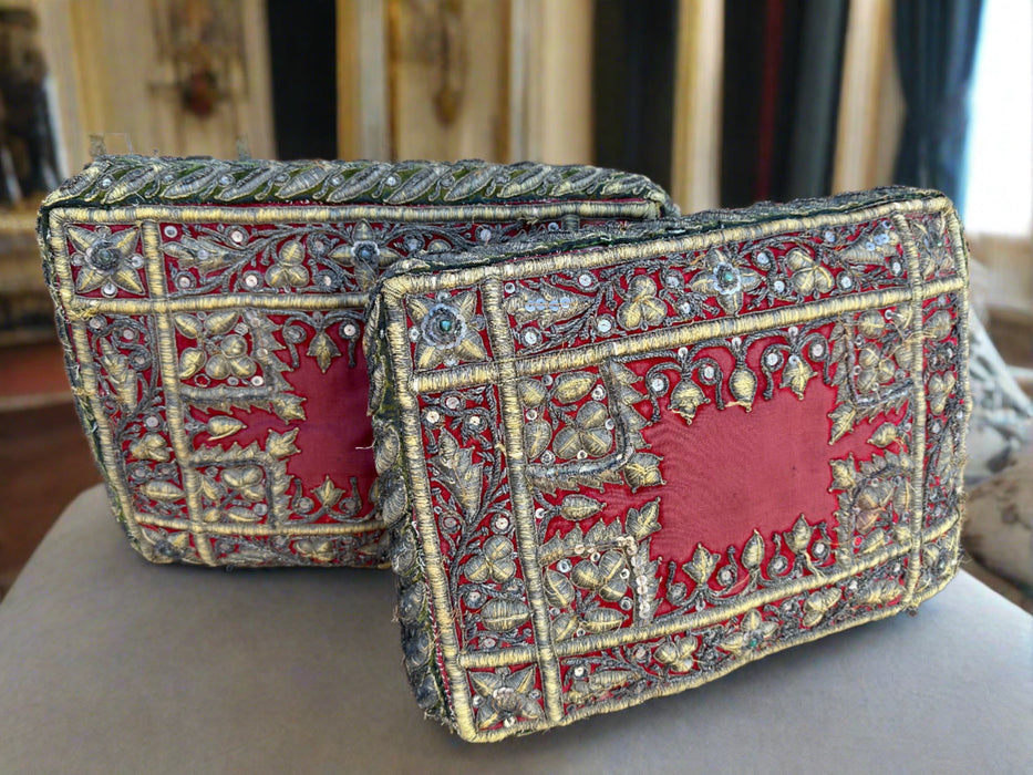 PAIR OF RED PILLOWS WITH GOLD DECORATIVE STITCHES