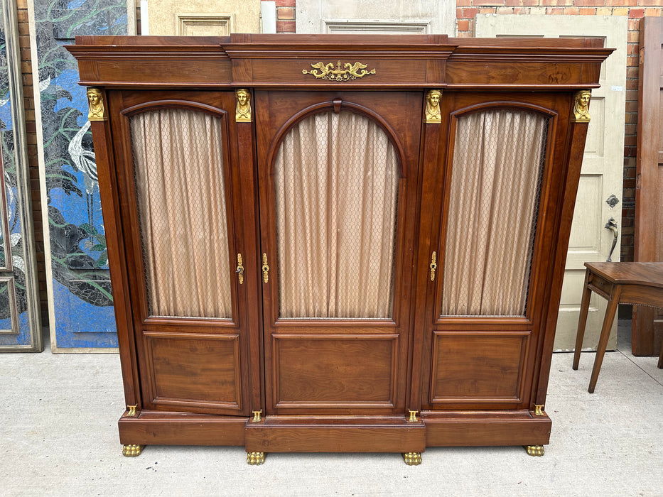 FRENCH EMPIRE MAHOGANY BOOKCASE WITH BRASS PAW FEET AND ORMOLU