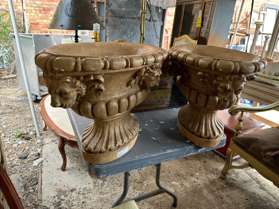 PAIR OF PLASTER URNS WITH LION FACES