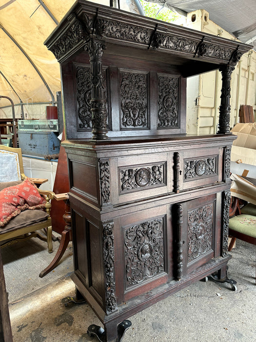 EARLY CARVED FRENCH CABINET WITH GRIFFINS AND PORTRAITS