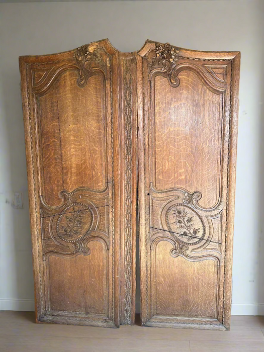 PAIR OF CARVED FRENCH OAK ARMOIRE DOORS