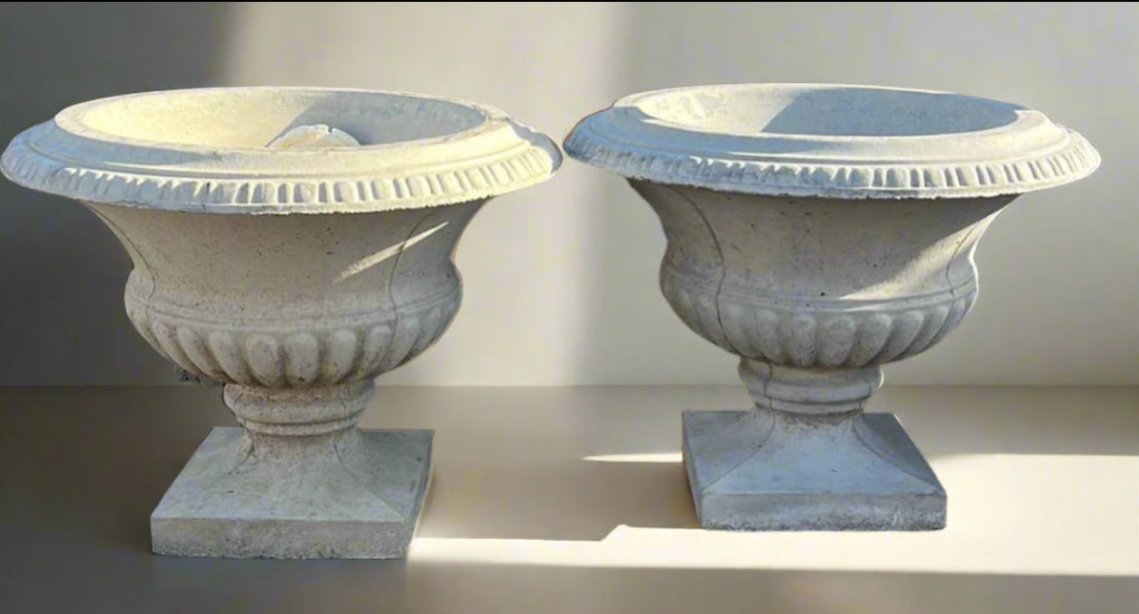 PAIR OF FOOTED CONCRETE PLANTERS