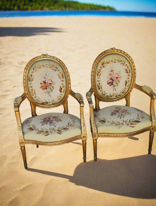 PAIR OF LOUIS XVI NEEDLEPOINT GILT FAUTEUILS (OPEN ARM CHAIRS}